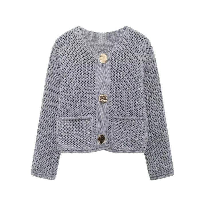 Light blue knitted cardigan with button details on a white background