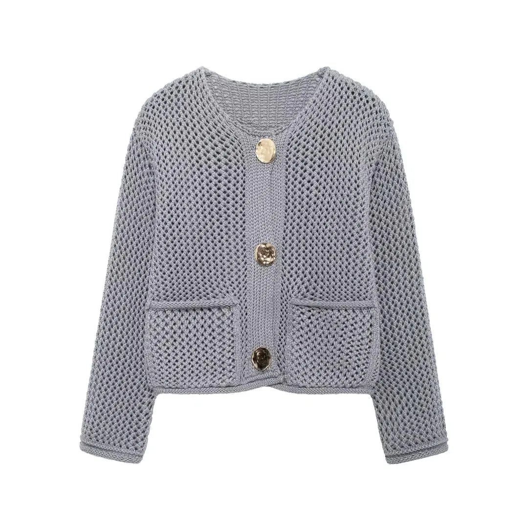 Light blue knitted cardigan with button details on a white background