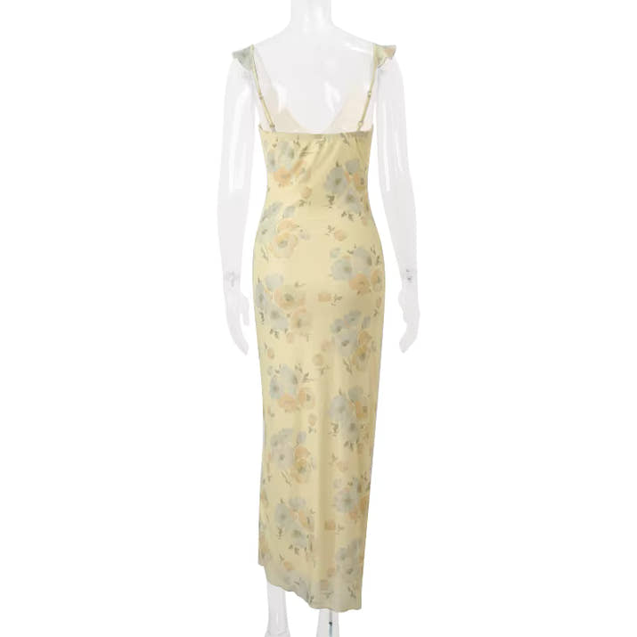 Yellow floral dress on a mannequin against a white background