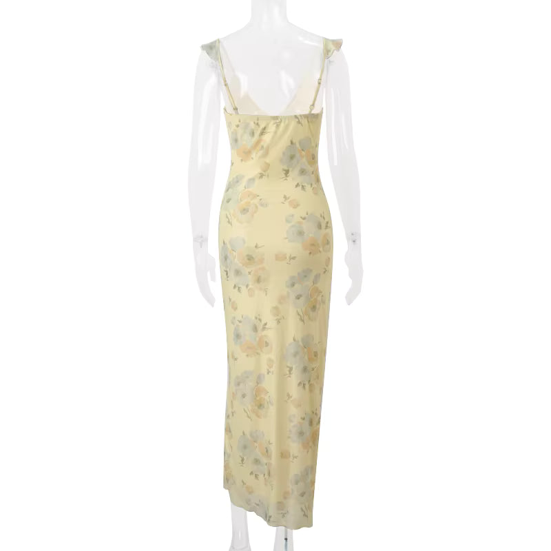Yellow floral dress on a mannequin against a white background