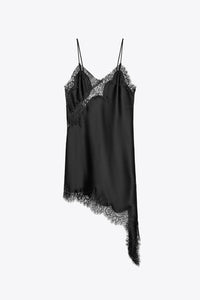 Black slip dress with lace details on a white background
