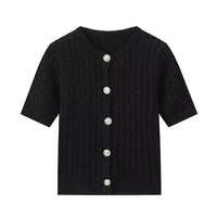 Black knitted cardigan with silver buttons on a white background