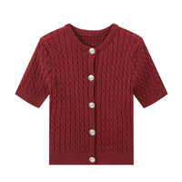 Burgundy knitted cardigan with buttons on a white background