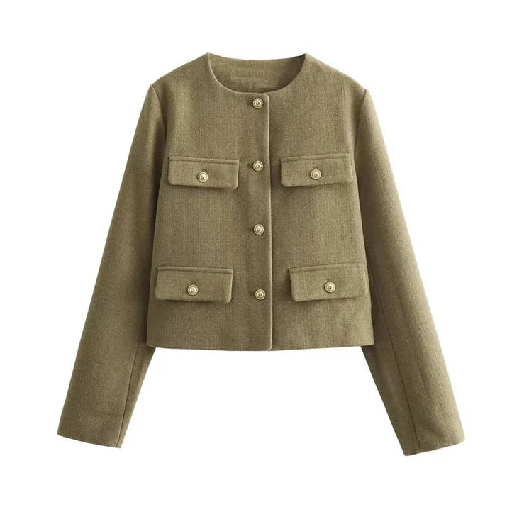 The woman looks casual and chic while walking around the city in a lightly cut khaki double-breasted tweed jacket with buttons.
