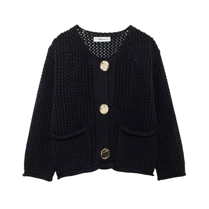 Black knitted cardigan with gold buttons on a white background