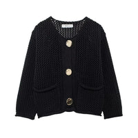 Black knitted cardigan with gold buttons on a white background
